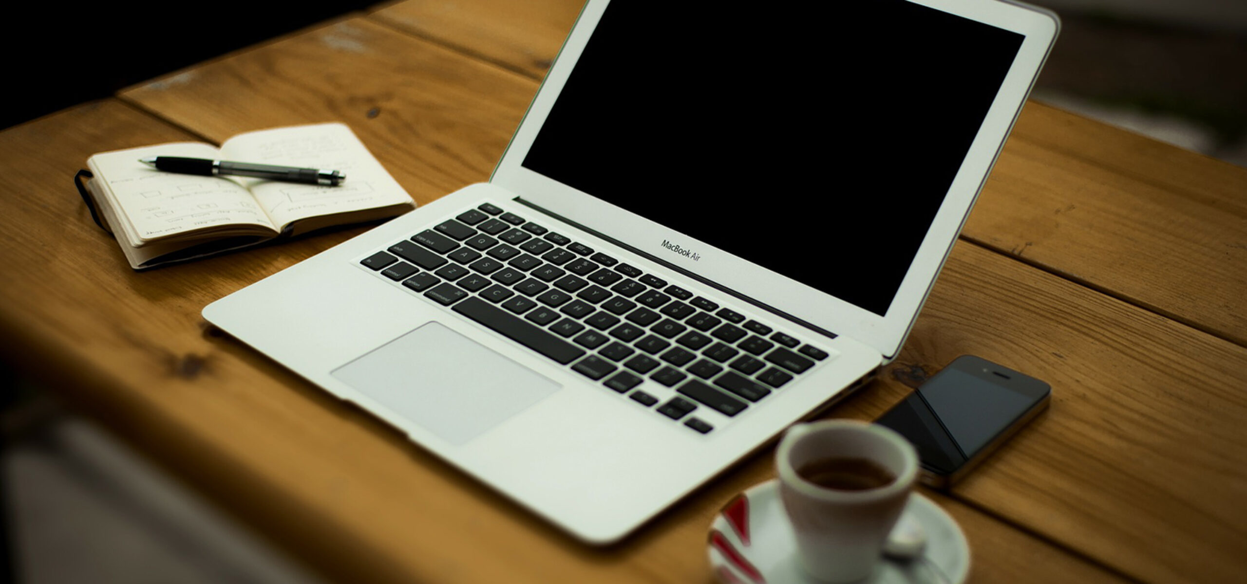 Laptop and notepad on a desk