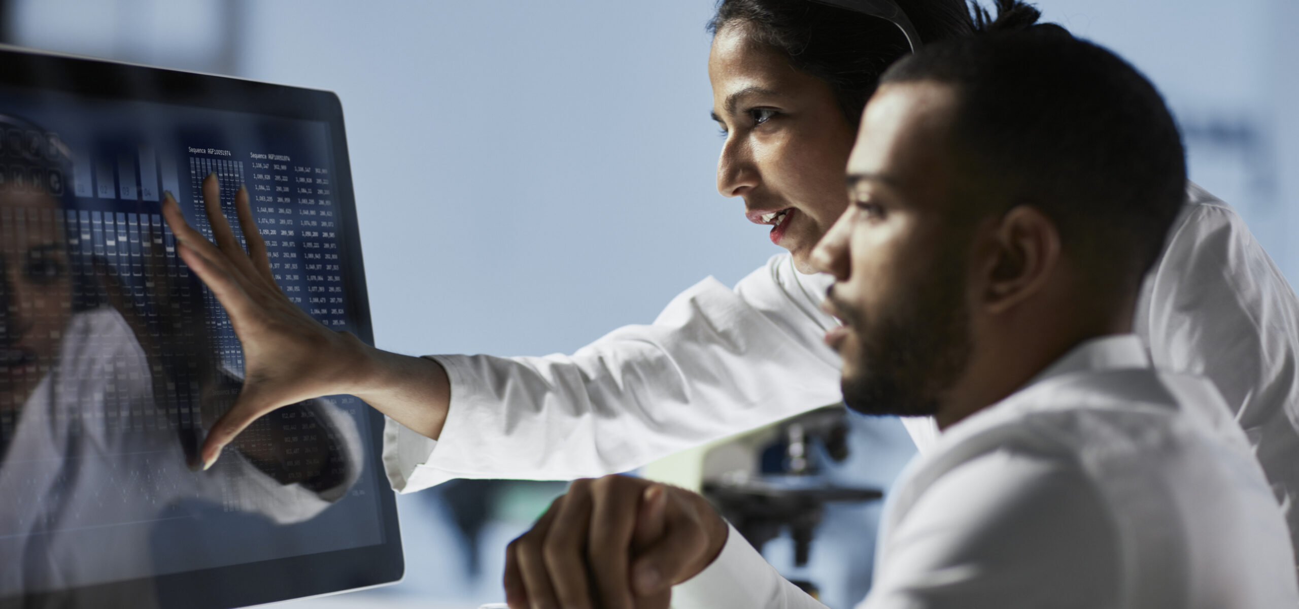 Scientists Working on Computer In Modern Laboratory