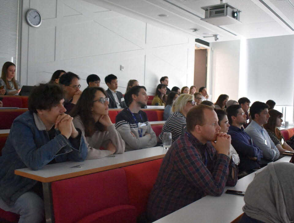 Audience members listening to speakers at the 2022 PGR Showcase